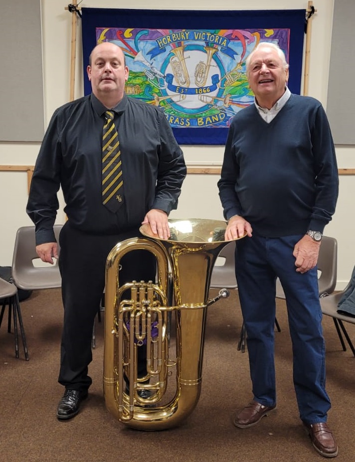 Our B♭ Bass player Nigel Hodson-Walker with a representative from the West Riding Masons Our B♭ Bass player Nigel Hodson-Walker with a representative from the West Riding Masons
